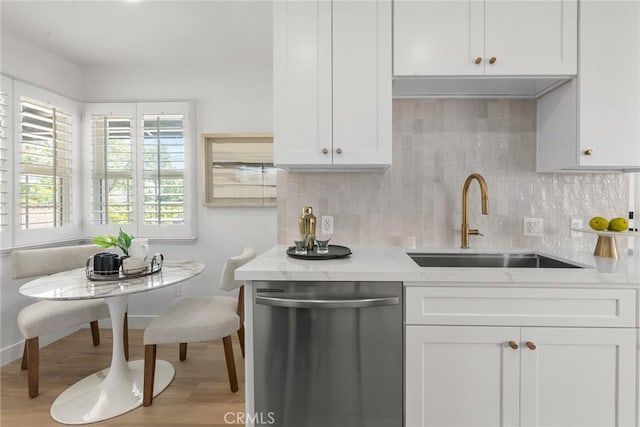 13807 Wyandotte St, Van Nuys, CA 91405 - kitchen featuring dishwasher, a sink, white cabinetry, wood finished floors, and tasteful backsplash