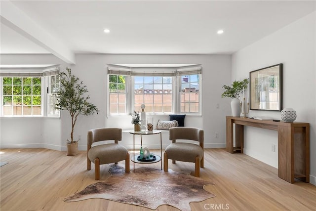 13807 Wyandotte St, Van Nuys, CA 91405 - sitting room featuring plenty of natural light, wood finished floors, baseboards, recessed lighting, and beam ceiling