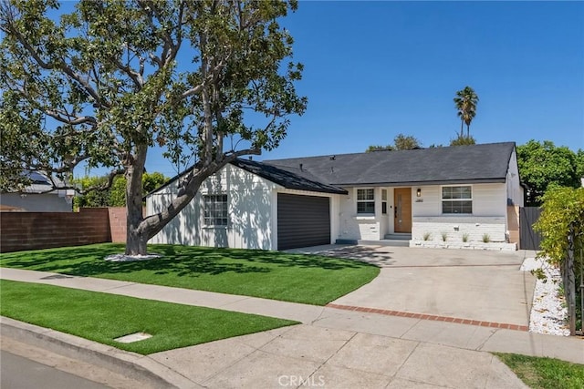 13807 Wyandotte St, Van Nuys, CA 91405 - single story home with driveway, a garage, and brick siding