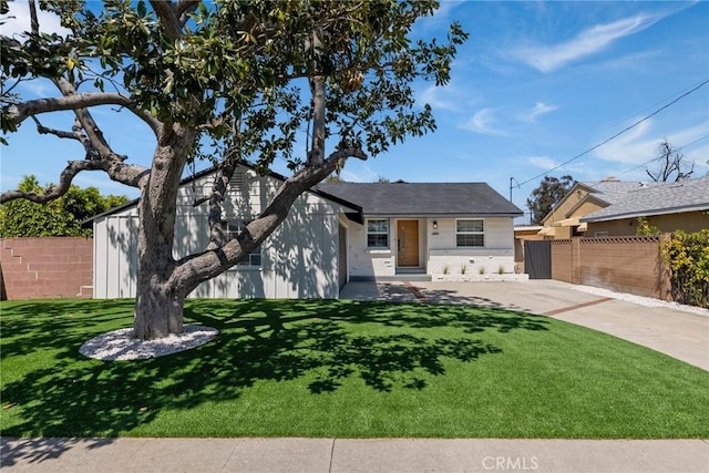 13807 Wyandotte St, Van Nuys, CA 91405 - view of front facade featuring concrete driveway and brick siding