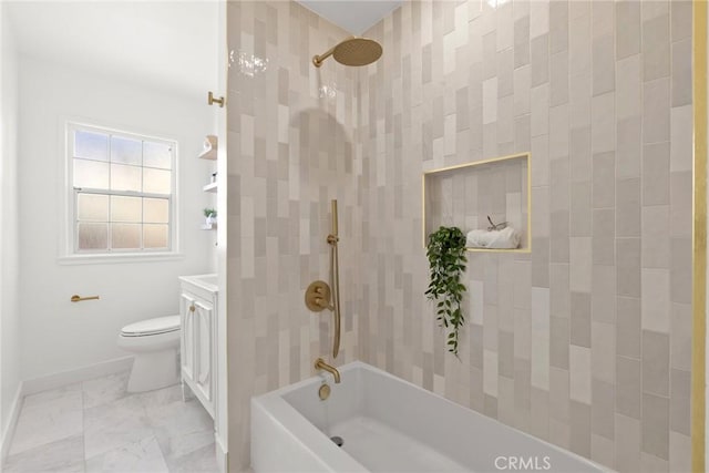 bathroom featuring vanity, marble finish floor, toilet, baseboards, and washtub / shower combination