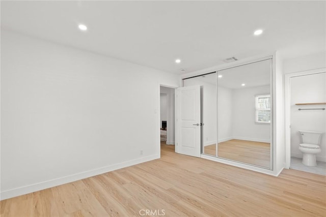 13807 Wyandotte St, Van Nuys, CA 91405 - unfurnished bedroom featuring light wood-style floors, recessed lighting, baseboards, ensuite bath, and a closet