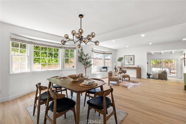 dining room featuring recessed lighting, light wood finished floors, baseboards, and a chandelier