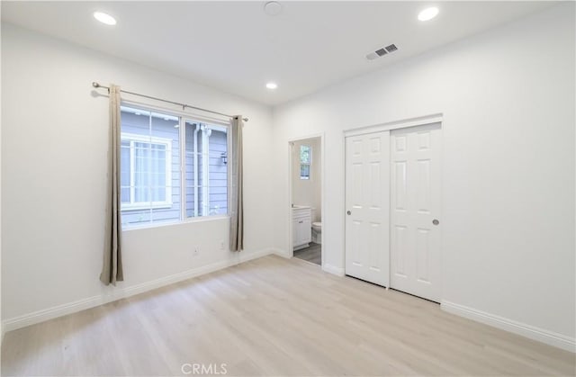 unfurnished bedroom with visible vents, baseboards, light wood-type flooring, and recessed lighting