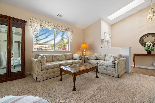 1400 Genoa Way, Santa Maria, CA 93455 - carpeted living area featuring vaulted ceiling with skylight, visible vents, and baseboards