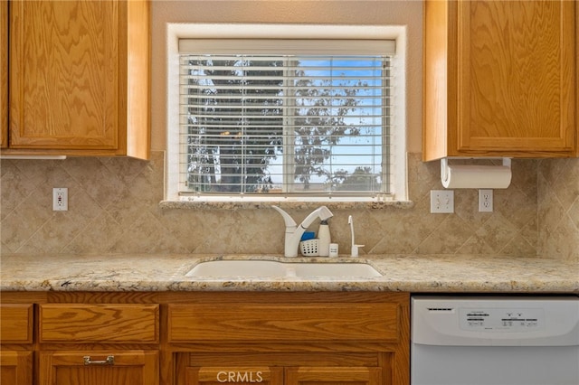 1400 Genoa Way, Santa Maria, CA 93455 - kitchen featuring a sink, decorative backsplash, white dishwasher, and light stone countertops