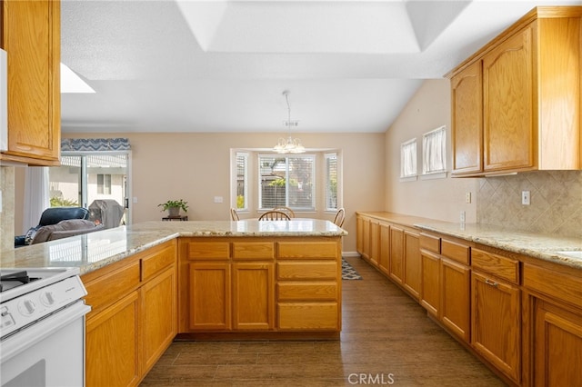 1400 Genoa Way, Santa Maria, CA 93455 - kitchen featuring white range with electric cooktop, wood finished floors, light stone counters, a notable chandelier, and backsplash