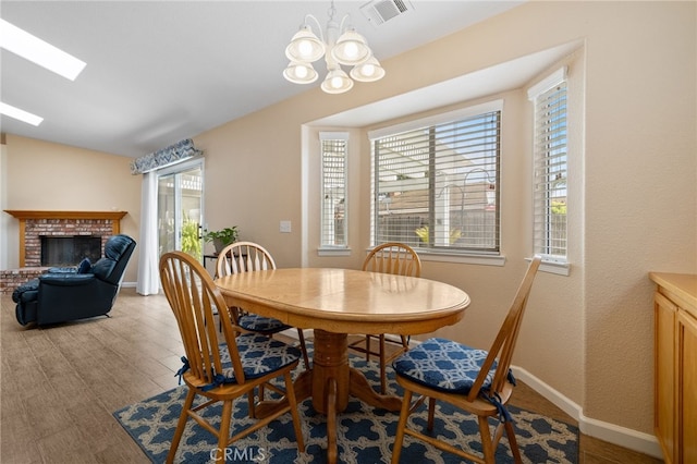 1400 Genoa Way, Santa Maria, CA 93455 - dining area featuring a chandelier, a healthy amount of sunlight, wood finished floors, and visible vents