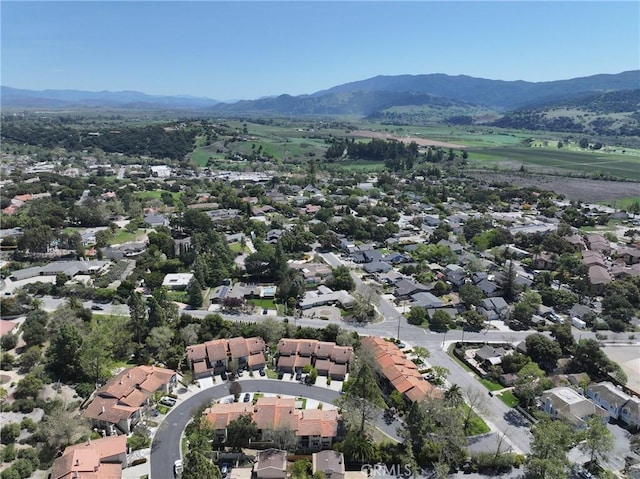 drone / aerial view featuring a mountain view and a residential view