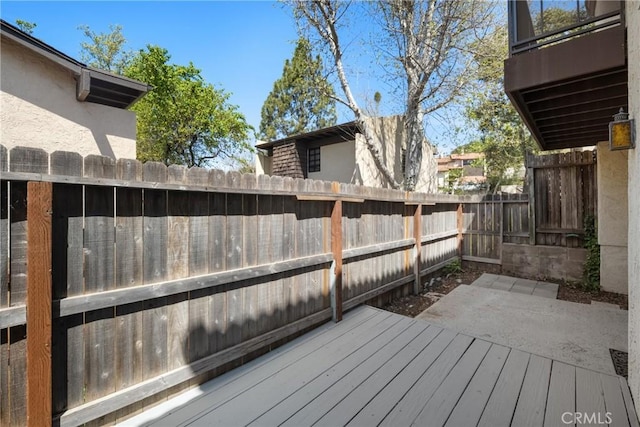 deck with a fenced backyard