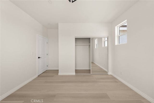 5978 Copperfield Ave, Riverside, CA 92506 - unfurnished bedroom with light wood-type flooring, baseboards, and a closet