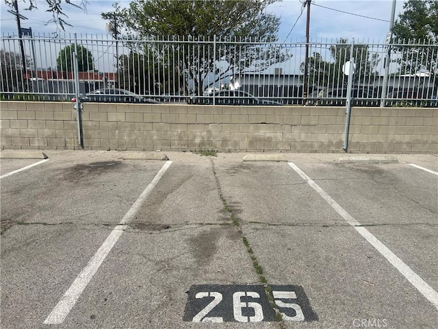 8601 International Ave Unit 265, Canoga Park, CA 91304 - uncovered parking lot featuring fence