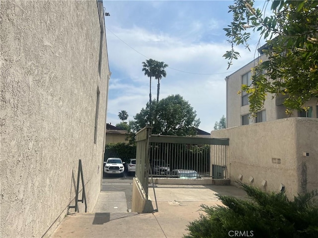 exterior space with fence and stucco siding