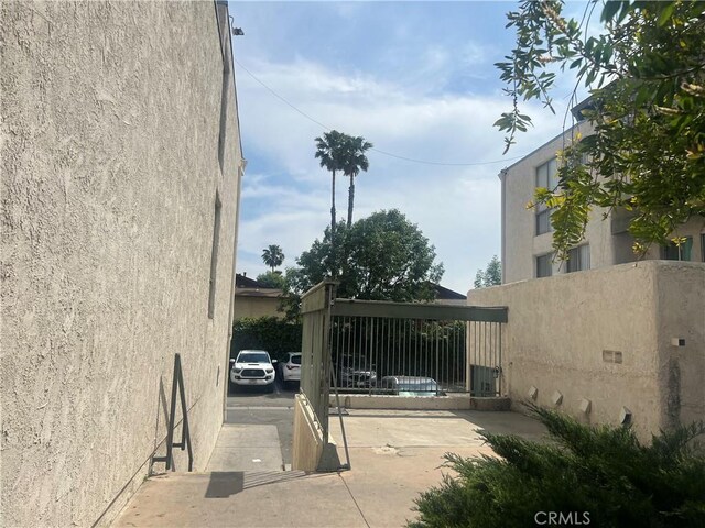 8601 International Ave Unit 265, Canoga Park, CA 91304 - view of property exterior with fence and stucco siding