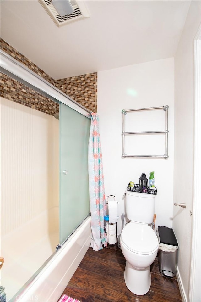 8601 International Ave Unit 265, Canoga Park, CA 91304 - bathroom with wood finished floors, combined bath / shower with glass door, toilet, and baseboards