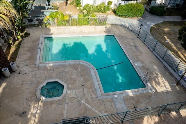 8601 International Ave Unit 265, Canoga Park, CA 91304 - community pool with an in-ground hot tub, fence, and a patio area