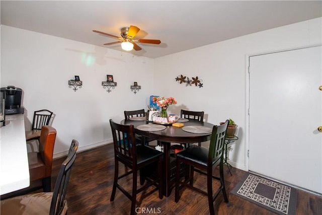 8601 International Ave Unit 265, Canoga Park, CA 91304 - dining room featuring a ceiling fan, wood finished floors, and baseboards