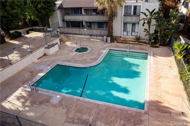 8601 International Ave Unit 265, Canoga Park, CA 91304 - community pool featuring a patio area and fence