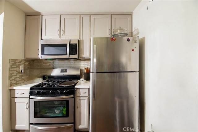 8601 International Ave Unit 265, Canoga Park, CA 91304 - kitchen with appliances with stainless steel finishes, light countertops, and backsplash