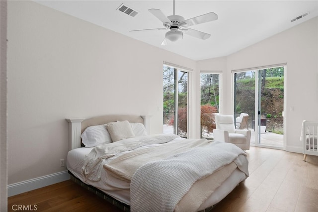11 Sycamore Valley Rd, Chico, CA 95973 - bedroom with access to outside, multiple windows, baseboards, wood finished floors, and vaulted ceiling