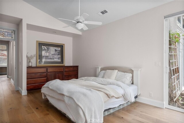 11 Sycamore Valley Rd, Chico, CA 95973 - bedroom featuring wood finished floors, access to outside, baseboards, and lofted ceiling