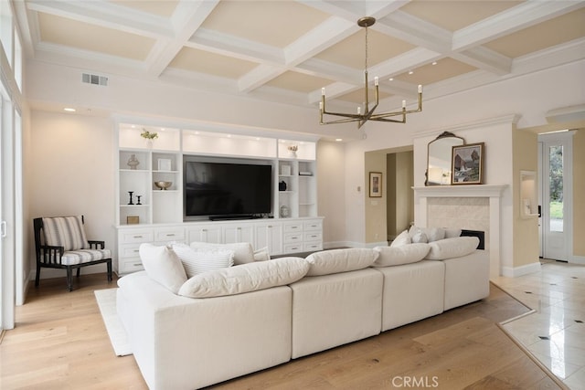 11 Sycamore Valley Rd, Chico, CA 95973 - living area featuring baseboards, coffered ceiling, beam ceiling, a chandelier, and a towering ceiling