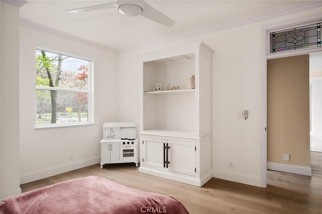 11 Sycamore Valley Rd, Chico, CA 95973 - bedroom with light wood finished floors, crown molding, baseboards, and ceiling fan