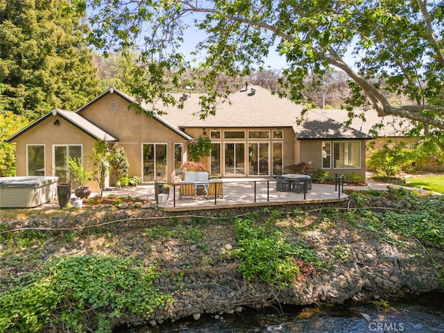 11 Sycamore Valley Rd, Chico, CA 95973 - rear view of house featuring a hot tub, a patio, and stucco siding
