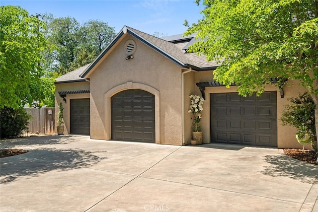 11 Sycamore Valley Rd, Chico, CA 95973 - view of front of house with concrete driveway, an attached garage, stucco siding, and roof with shingles