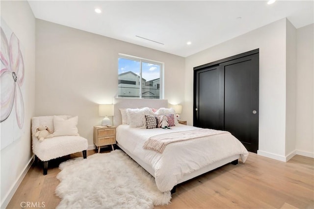 607 12th St, Huntington Beach, CA 92648 - bedroom with light wood-style flooring, recessed lighting, and baseboards
