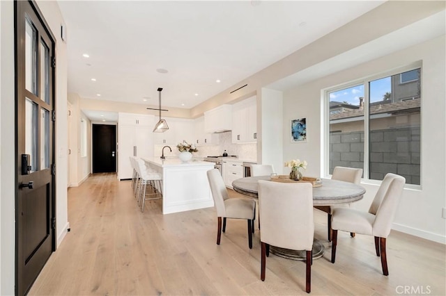 607 12th St, Huntington Beach, CA 92648 - dining space featuring recessed lighting, light wood-style flooring, and baseboards
