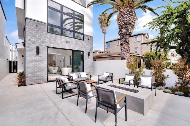 607 12th St, Huntington Beach, CA 92648 - view of patio / terrace with an outdoor living space with a fire pit