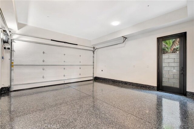607 12th St, Huntington Beach, CA 92648 - garage featuring baseboards