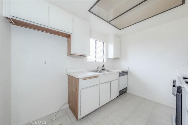 kitchen featuring stainless steel dishwasher, a sink, light countertops, baseboards, and white cabinetry