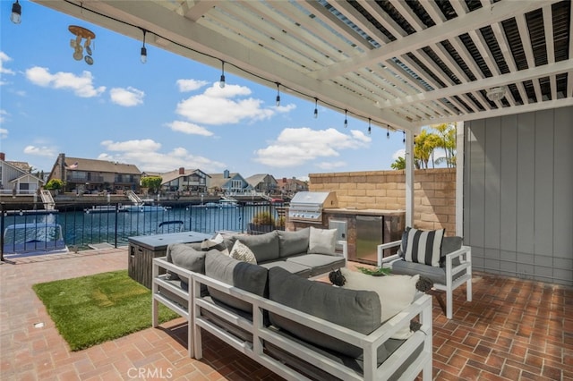 view of patio / terrace featuring a water view, area for grilling, grilling area, an outdoor living space, and fence