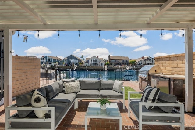view of patio featuring a water view, a residential view, area for grilling, and an outdoor hangout area