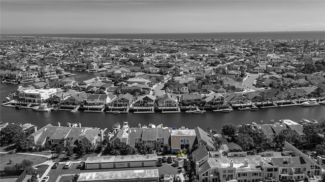 birds eye view of property featuring a residential view and a water view