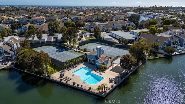 bird's eye view featuring a water view and a residential view