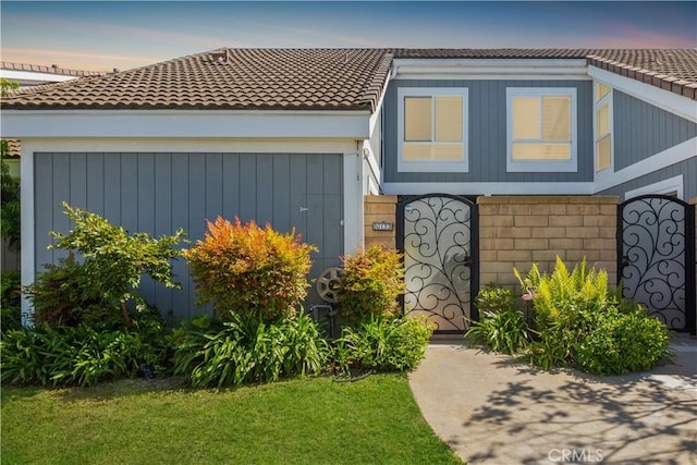 view of front of property featuring a tile roof