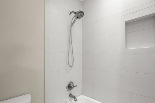 full bath with bathtub / shower combination and toilet