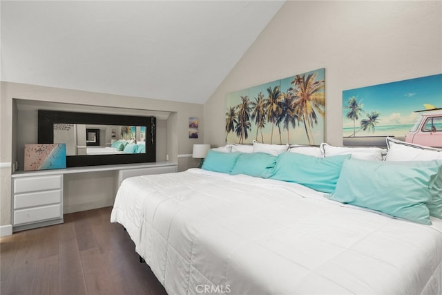 bedroom with vaulted ceiling and wood finished floors