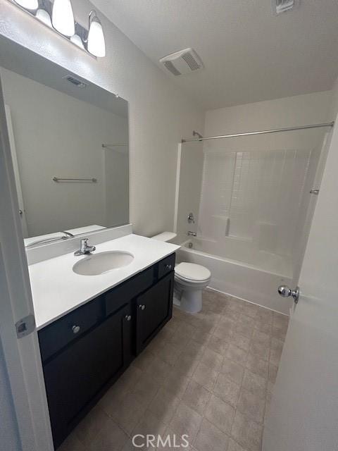 771 Brent Ct, Merced, CA 95341 - bathroom with vanity, shower / bathtub combination, and toilet
