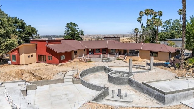 back of house with a patio area