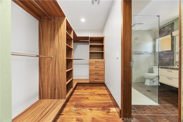 walk in closet with visible vents
