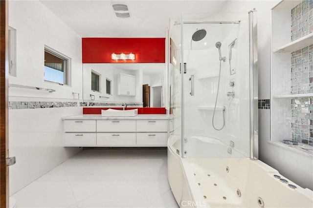 bathroom featuring tile patterned floors, vanity, and tile walls