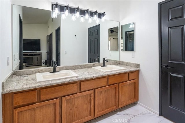 42370 61st St W, Lancaster, CA 93536 - bathroom with double vanity, marble look tile flooring, and a ceiling fan