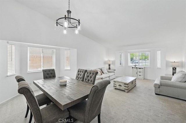 42370 61st St W, Lancaster, CA 93536 - dining space with lofted ceiling, light carpet, and a chandelier