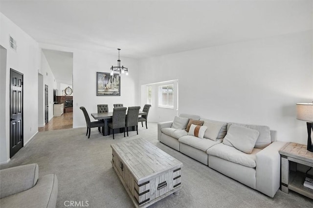 42370 61st St W, Lancaster, CA 93536 - living room with a chandelier, carpet flooring, and vaulted ceiling