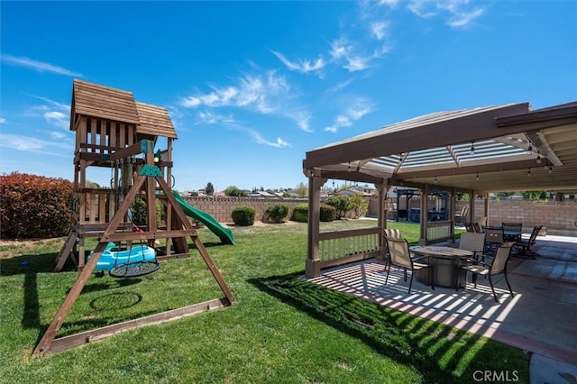 42370 61st St W, Lancaster, CA 93536 - view of playground with a fenced backyard, a patio, and a fire pit