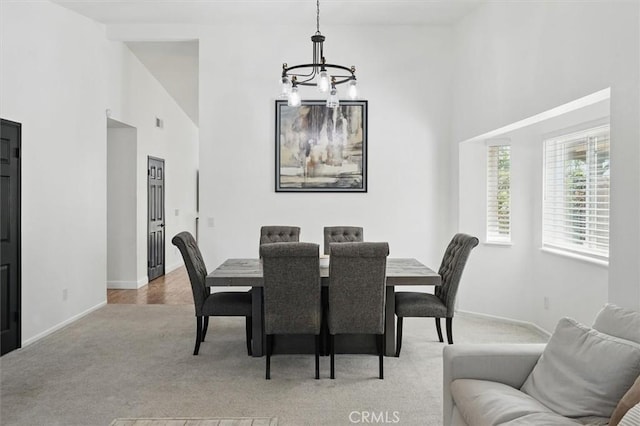 42370 61st St W, Lancaster, CA 93536 - dining area featuring a chandelier, carpet flooring, and high vaulted ceiling